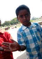 A boy showing of henna on his hand, Humpi