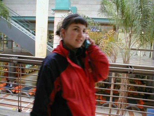 Cousin taking pix of me walking through the mall & talking on the phone