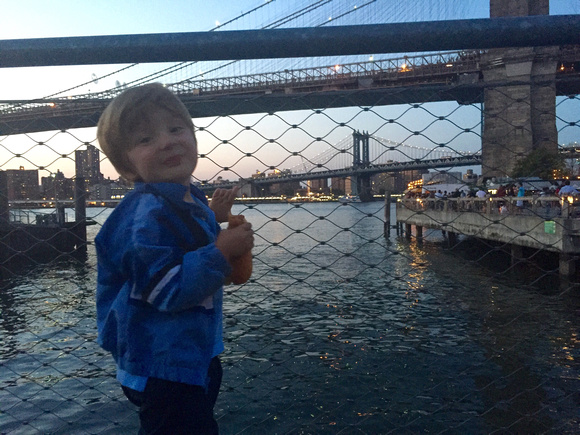 East River, Two Bridges and a hot dog in hand... This be their first taste of NYC!