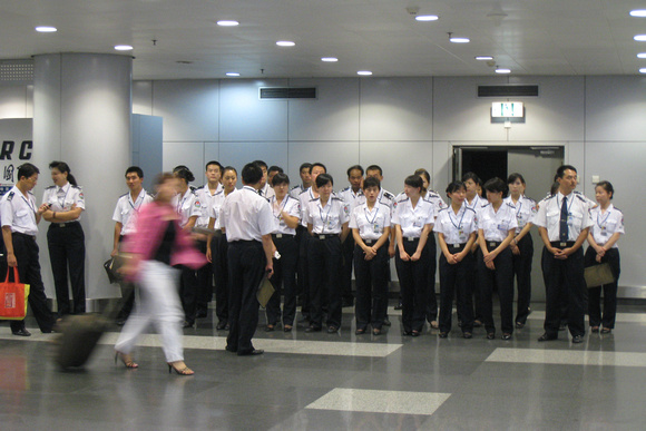 Airport employees lined up before their shift